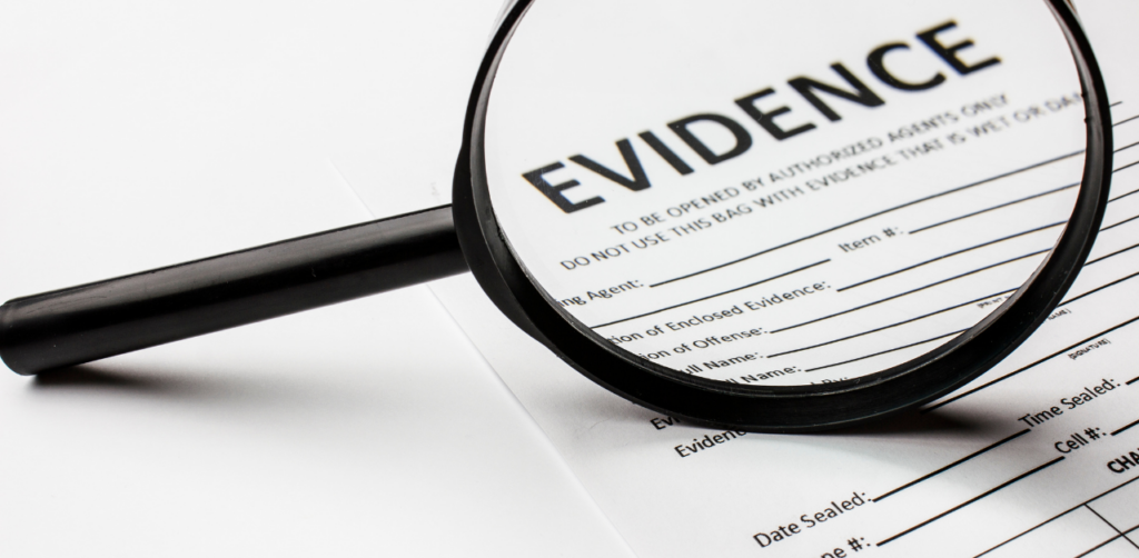 A magnifying glass highlighting the word "EVIDENCE" on an official document form