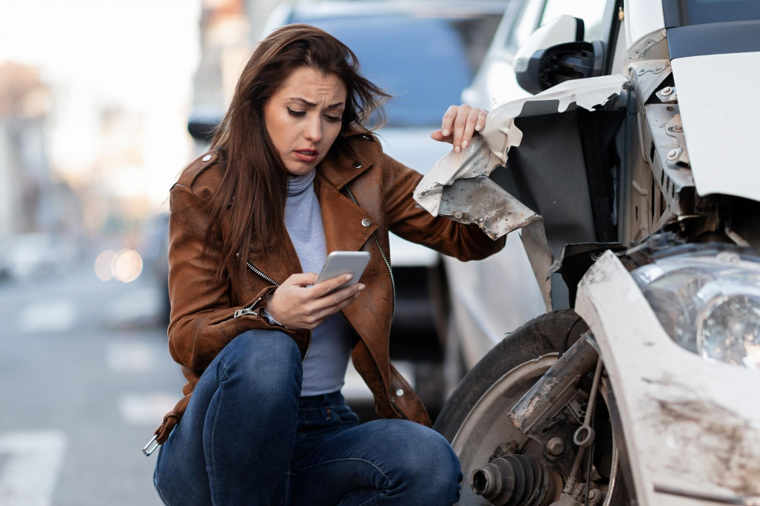 woman-text-messaging-smart-after-car-crash-road