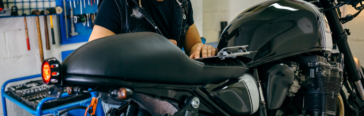 Mechanic fixing a motorcycle