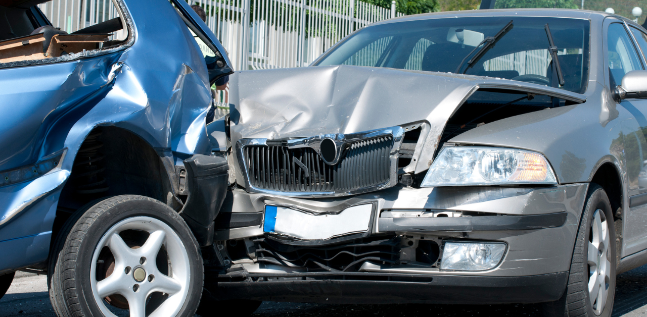 Two cars with major front-end damage after crash, illustrating need for accident compensation