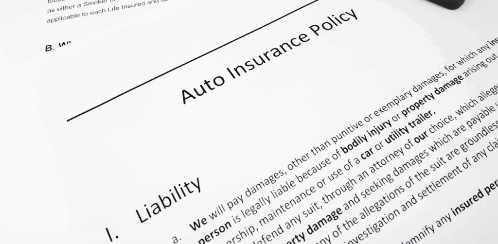 Close-up of an auto insurance policy document showing liability coverage details