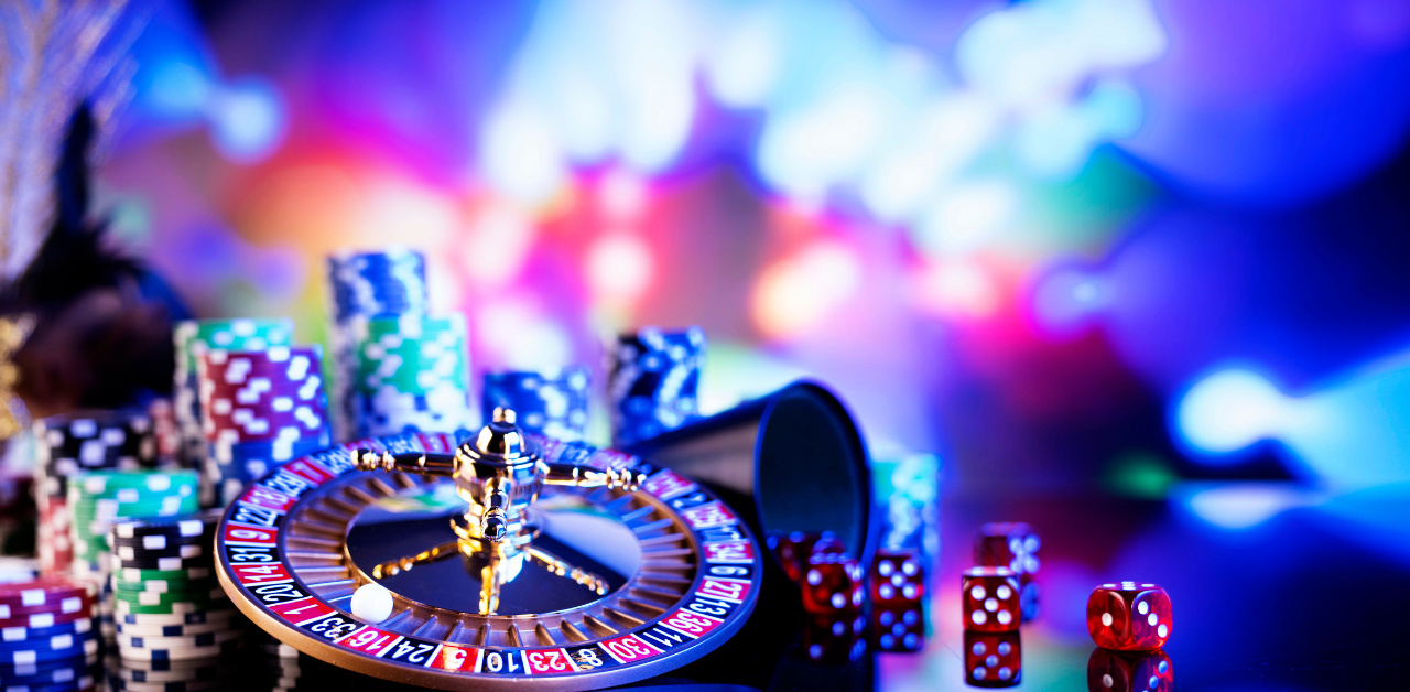 Roulette wheel with chips and dice on casino table, representing gambling, betting, and chance games