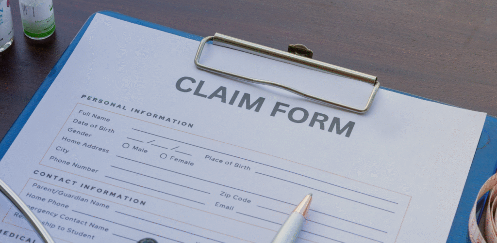 Close-up of a claim form on a clipboard, ready to be completed